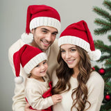 Couple wearing red Christmas hats"