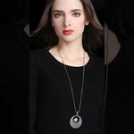Blue crystal round pendant necklace video showcasing luxury statement jewelry with sparkling rhinestones and gold plated setting for women
