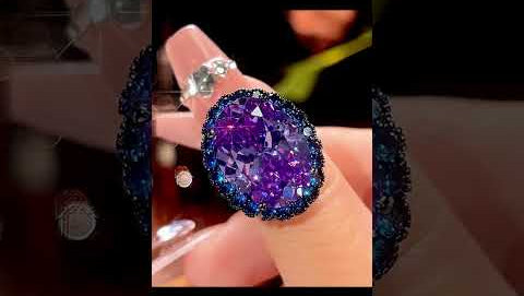 Stunning blue spinel oval pendant necklace showcasing brilliant faceted gemstone with sparkling rhinestone halo in sterling silver setting, displayed from multiple angles with close-up details of the intricate craftsmanship and light reflection
