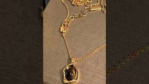 Natural tiger eye stone pendant necklace with gold plated chain - elegant women's jewelry gift unboxing and close-up review showing brown gemstone chatoyant effect
